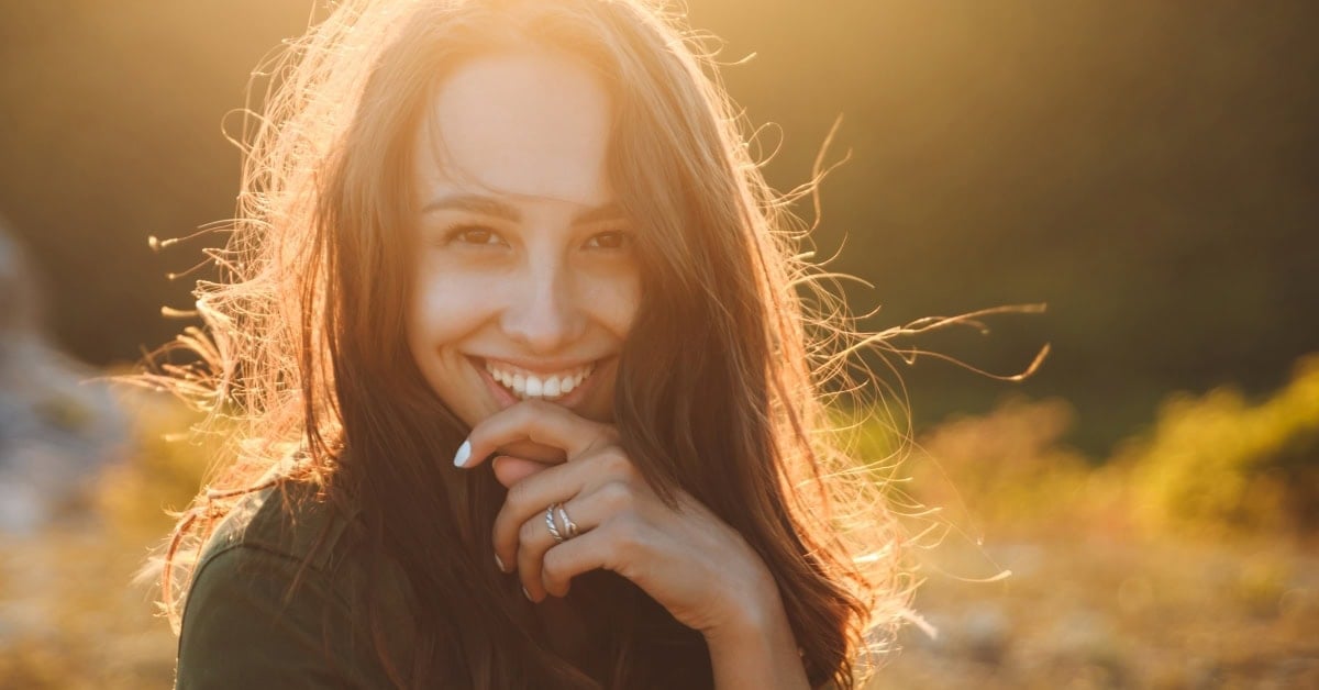 Image of smiling woman. She looks happy.