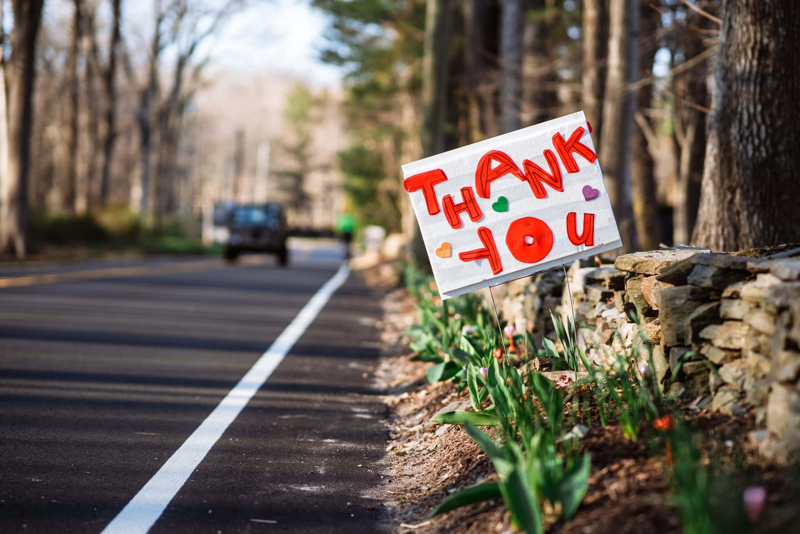 image of a home made road sign that reads "Thank You"